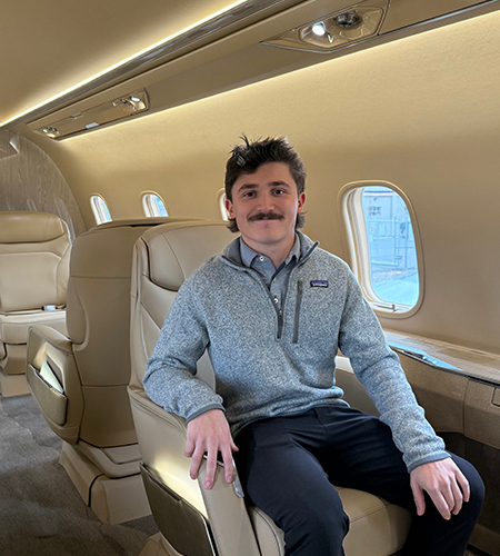Preston of Peak Aviation Solutions in a private jet cabin